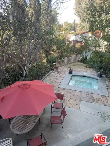 a pathway of a house with a yard