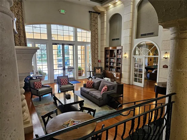a view of a livingroom with furniture window and wooden floor