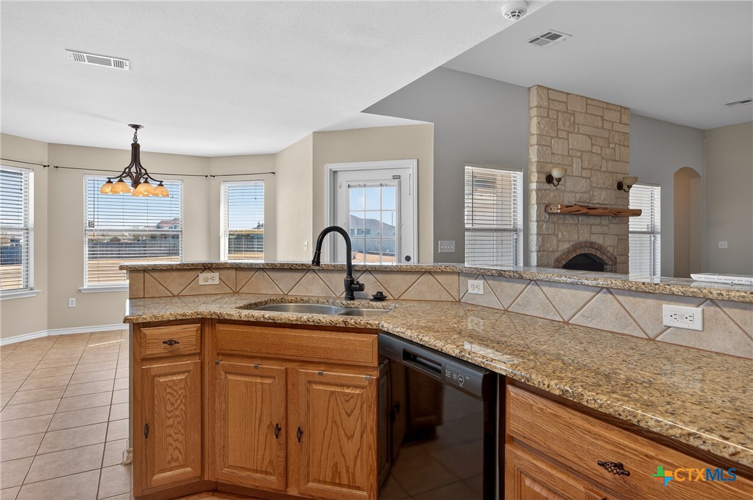 8407 Shaw Road Rogers, TX 76569 - Photo 11 of 25 a kitchen with cabinets and sink