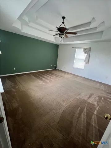a view of a big room with carpet