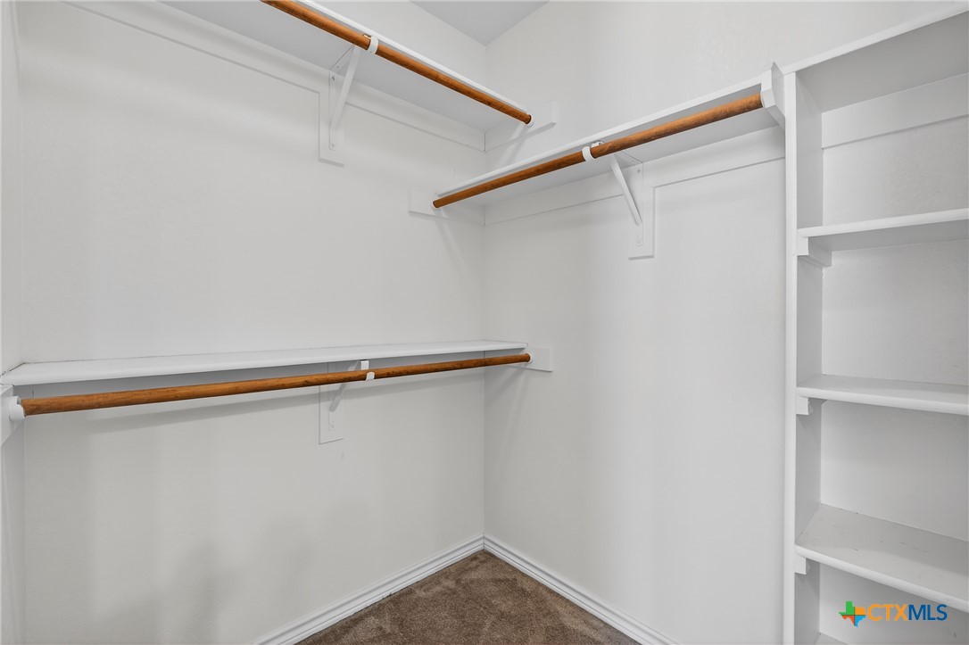 8407 Shaw Road Rogers, TX 76569 - Photo 19 of 25 a view of small space with racks on the wall