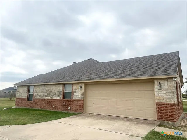 a house view with a garden space
