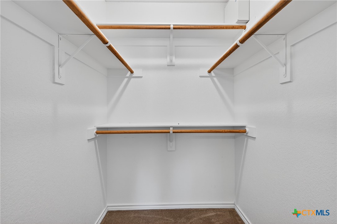 8407 Shaw Road Rogers, TX 76569 - Photo 22 of 25 a view of walk in closet