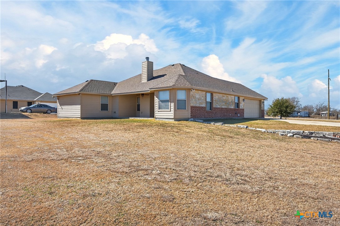 8407 Shaw Road Rogers, TX 76569 - Photo 4 of 25 a view of a house with a yard