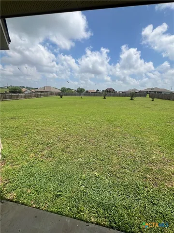a view of a lake and a yard