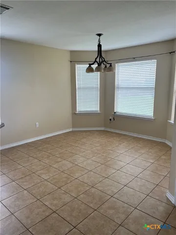 a view of a room that has a window in it