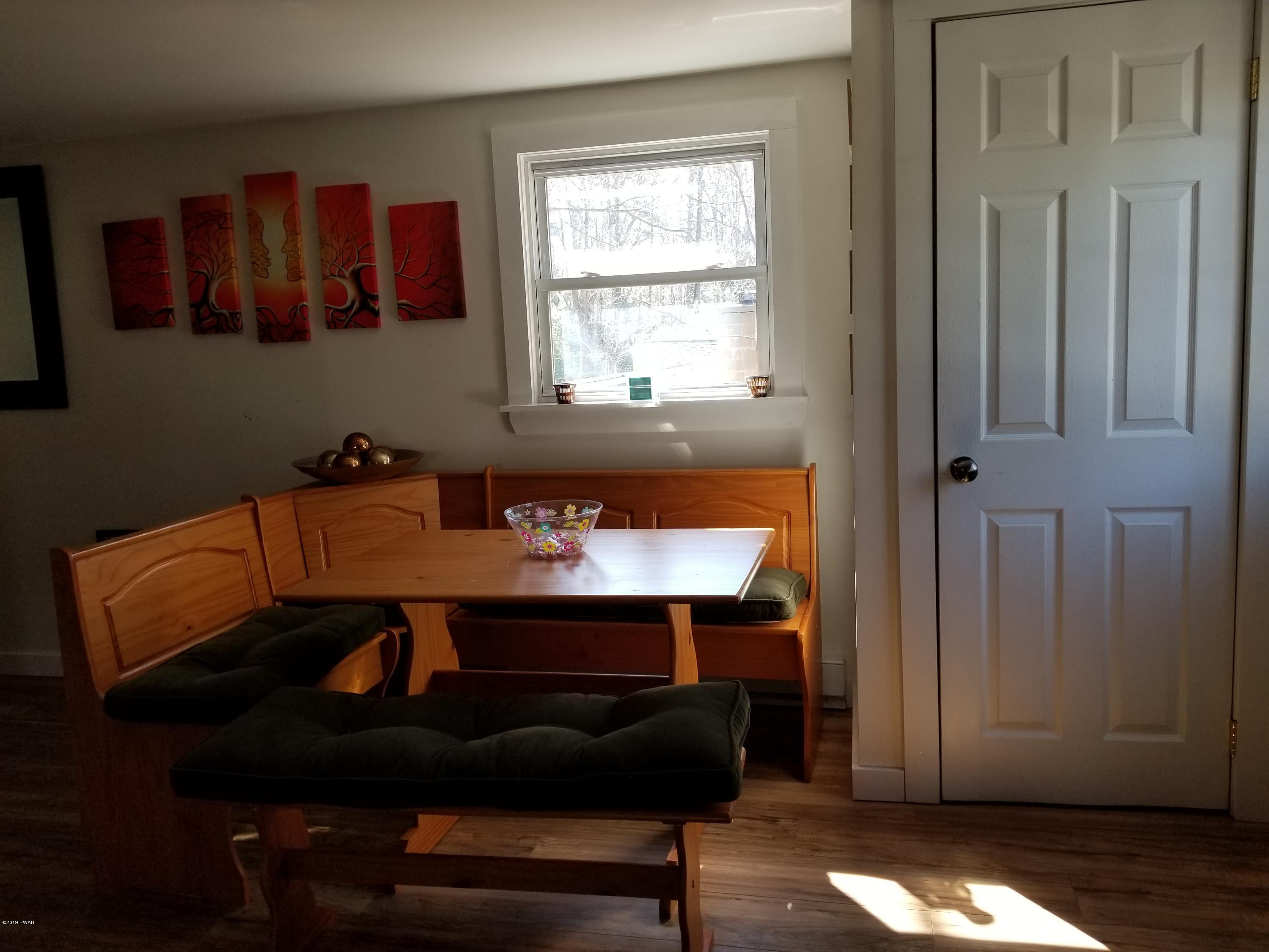 108 Red Pine Road Dingmans Ferry, PA 18328 - Photo 4 of 15 a room with a table and a window
