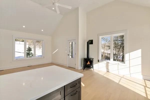 a view of a room with a window and a kitchen view