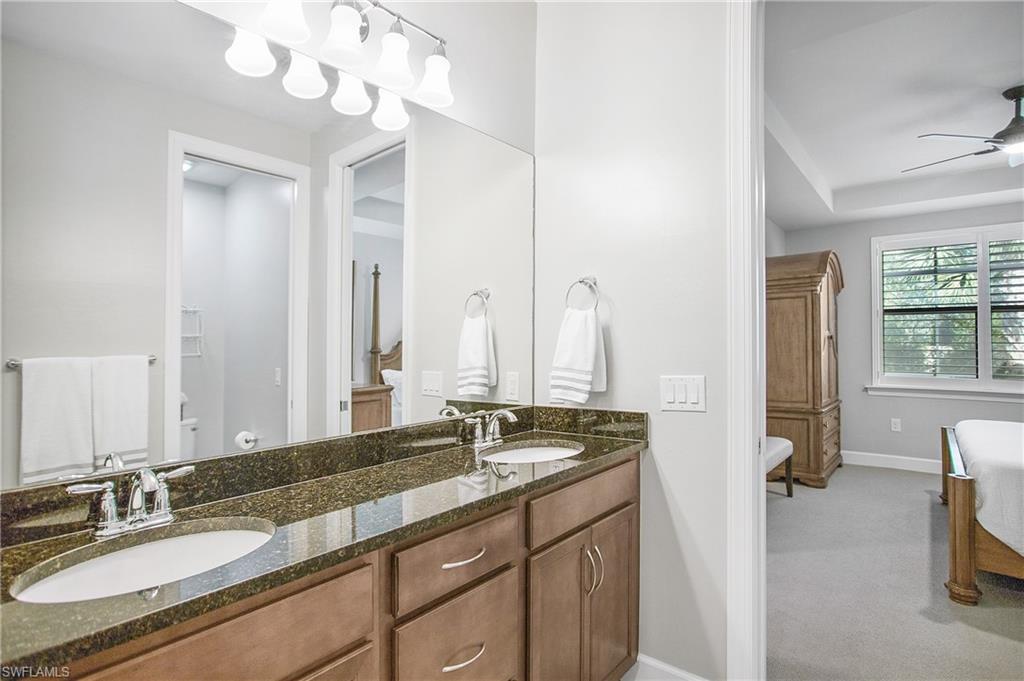 7674 Jacaranda Lane Naples, FL 34114 - Photo 11 of 45 a bathroom with a sink double vanity and a mirror