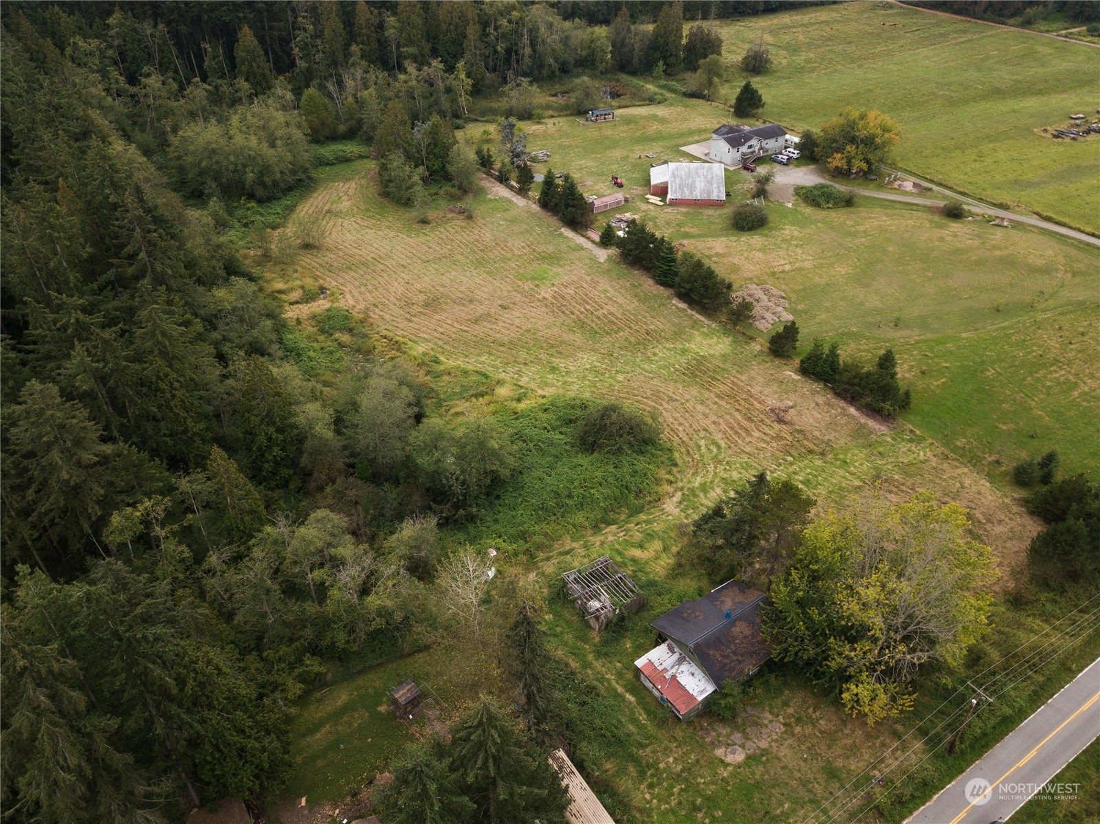 4415 Hall Road Blaine, WA 98230 - Photo 6 of 8 a view of a houses with a yard