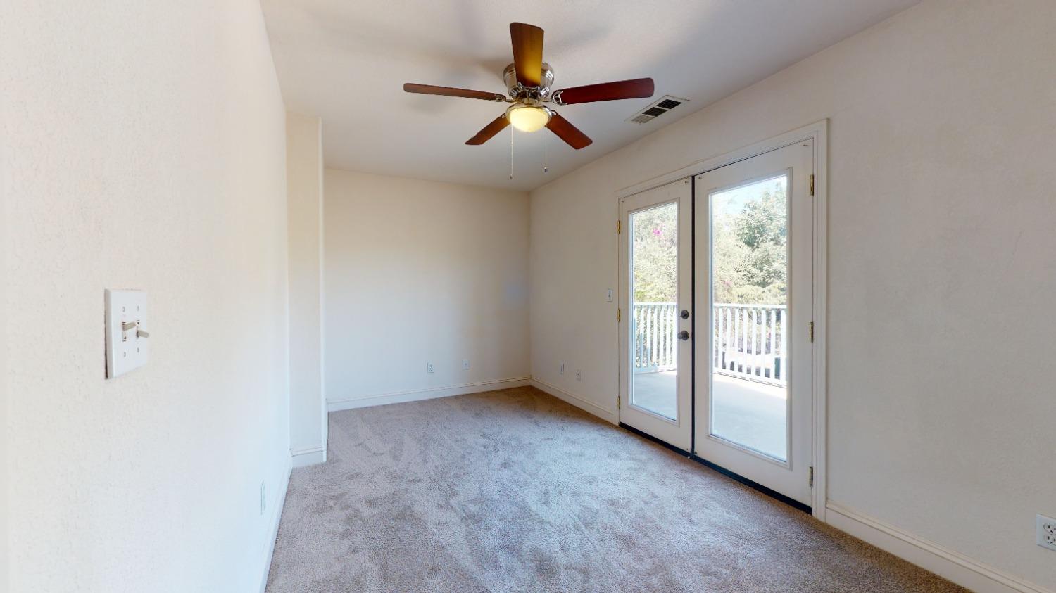 926 North Frankwood Avenue Reedley, CA 93654 - Photo 18 of 32 an empty room with ceiling fan and windows