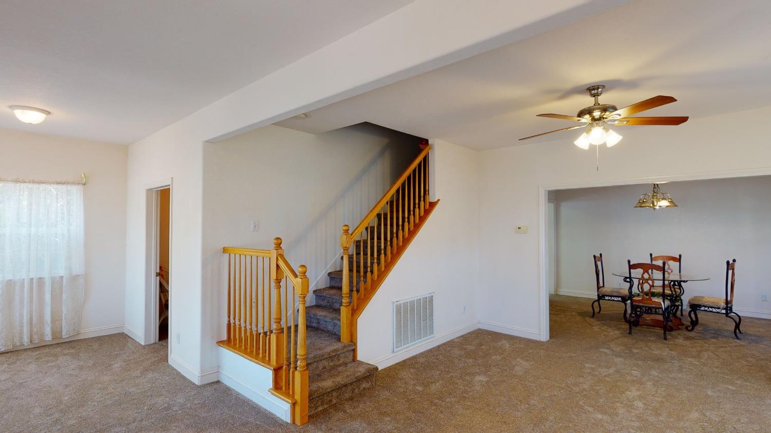 926 North Frankwood Avenue Reedley, CA 93654 - Photo 6 of 32 a view of a livingroom with furniture and a hallway