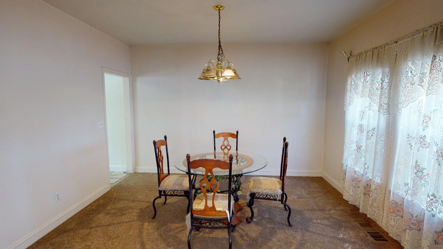 926 North Frankwood Avenue Reedley, CA 93654 - Photo 9 of 32 a dining room with furniture and window