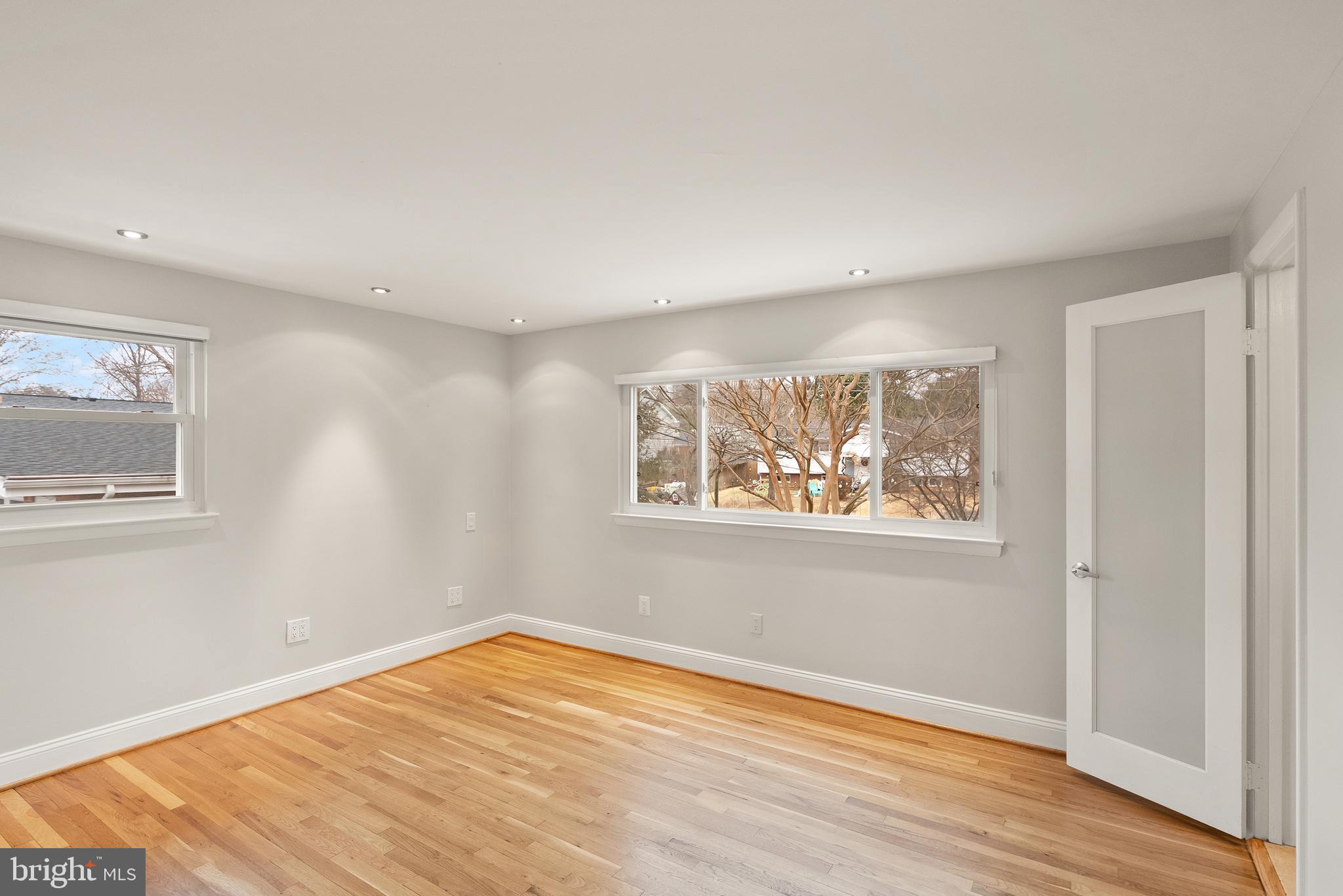 5004 Regency Place Alexandria, VA 22304 - Photo 11 of 36 a view of an empty room with wooden floor and a window