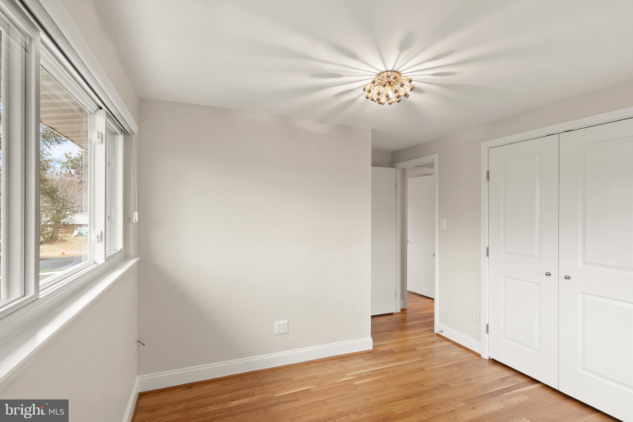 5004 Regency Place Alexandria, VA 22304 - Photo 16 of 36 a view of an empty room with wooden floor and a window