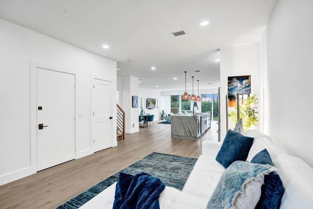 6800 Via Regina Boca Raton, FL 33433 - Photo 16 of 58 a living room with furniture and a wooden floor