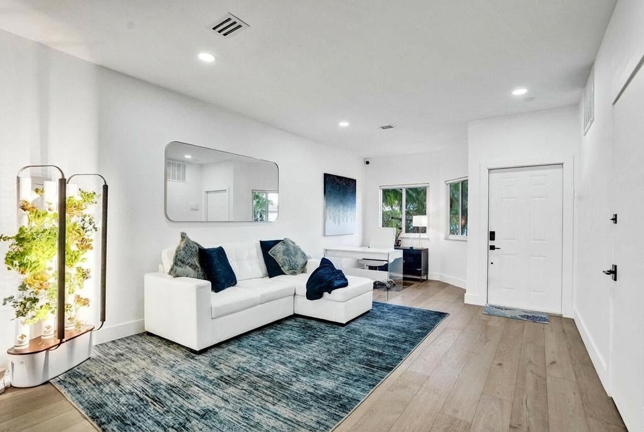 6800 Via Regina Boca Raton, FL 33433 - Photo 17 of 58 a living room with furniture and a rug