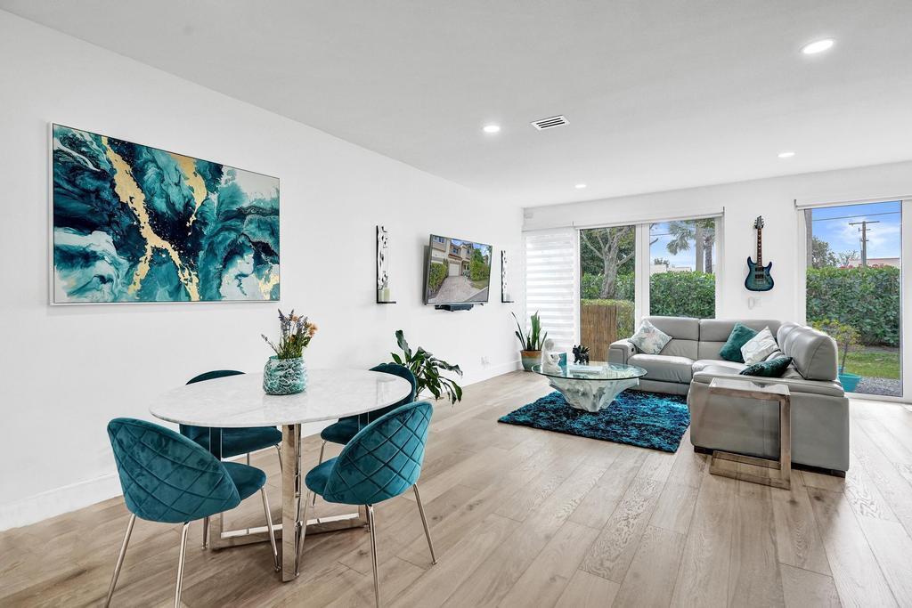 6800 Via Regina Boca Raton, FL 33433 - Photo 20 of 58 a living room with furniture and a large window