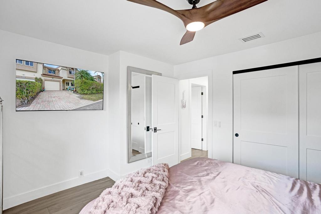 6800 Via Regina Boca Raton, FL 33433 - Photo 37 of 58 a bedroom with a bed and a window