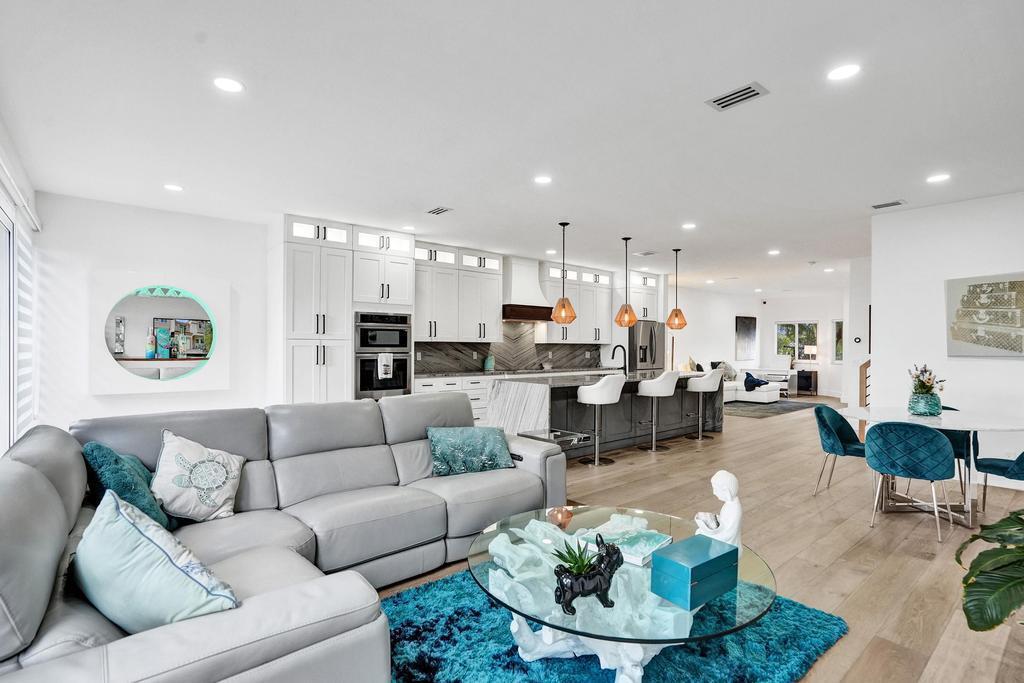 6800 Via Regina Boca Raton, FL 33433 - Photo 4 of 58 a living room with furniture kitchen view and a table