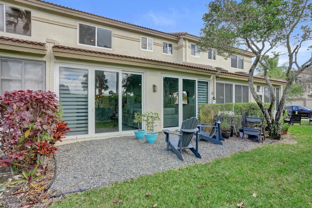 6800 Via Regina Boca Raton, FL 33433 - Photo 45 of 58 a view of a house with a yard and sitting area