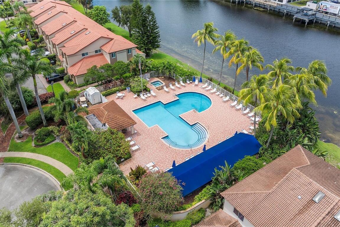 6800 Via Regina Boca Raton, FL 33433 - Photo 52 of 58 an aerial view of a house with a swimming pool a yard and a garden