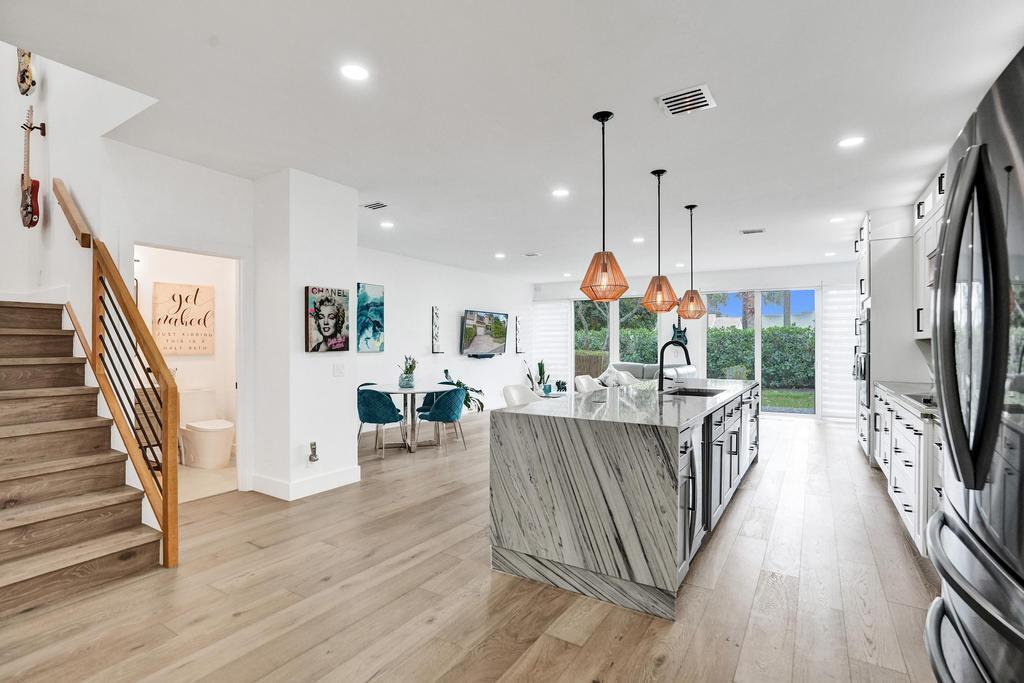 6800 Via Regina Boca Raton, FL 33433 - Photo 6 of 58 a living room with furniture a fireplace and a flat screen tv