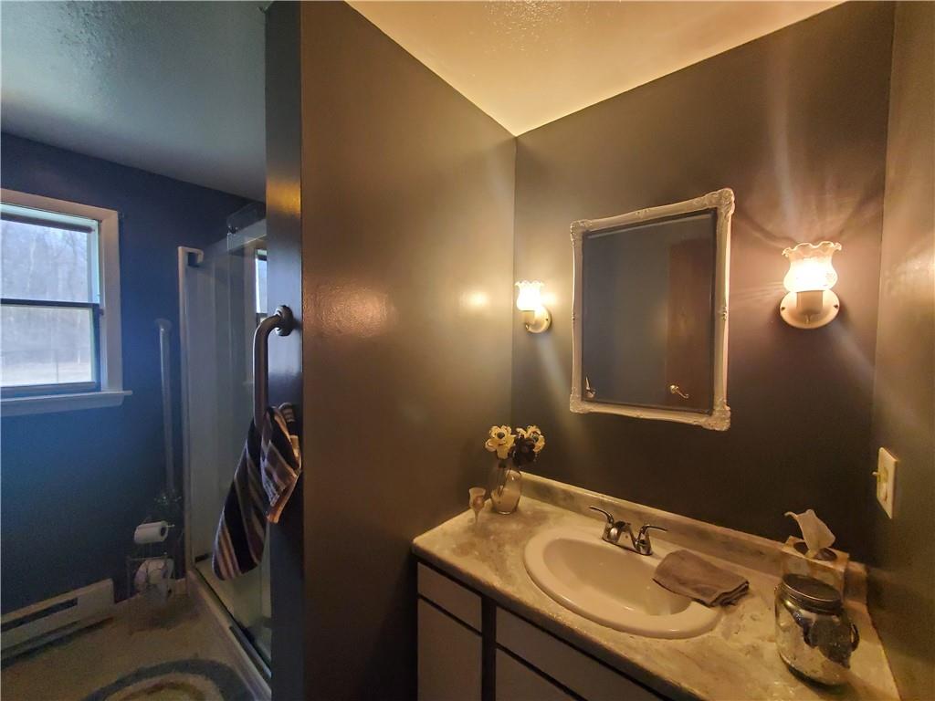 1502 County Line Road Champion, PA 15622 - Photo 13 of 22 a bathroom with a sink and mirror
