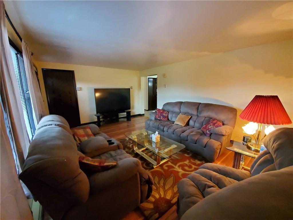 1502 County Line Road Champion, PA 15622 - Photo 7 of 22 a living room with furniture and a flat screen tv