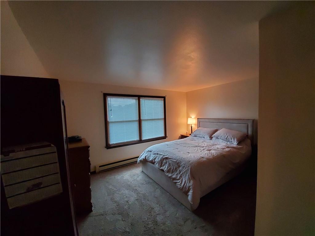 1502 County Line Road Champion, PA 15622 - Photo 10 of 22 a bedroom with a bed and a window