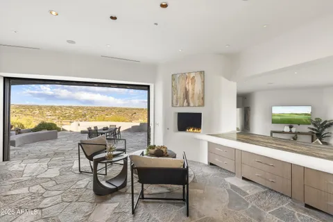 a kitchen with a sink and a large mirror