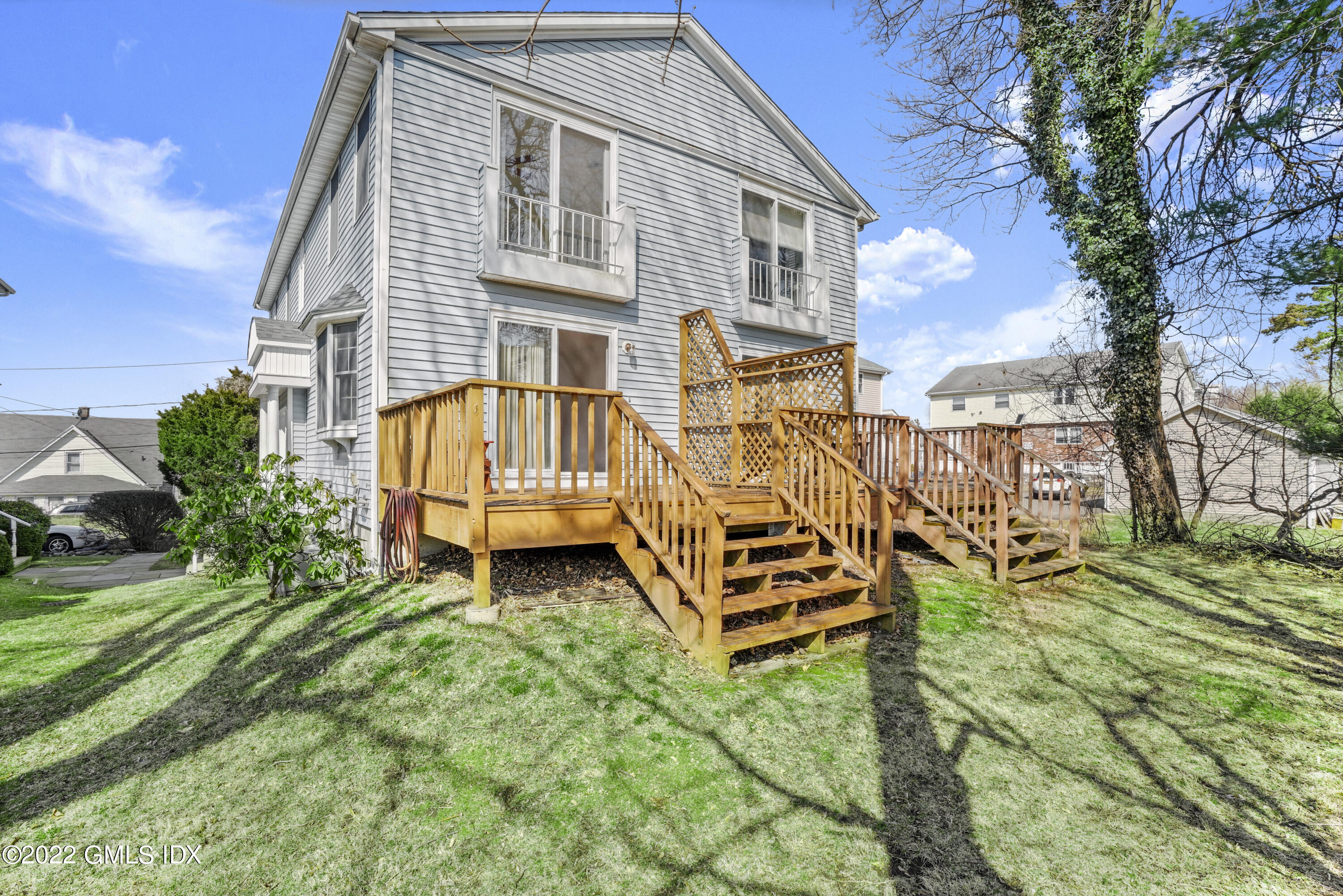 39 Alexander Street, Unit B Greenwich, CT 06830 - Photo 13 of 17 a view of a house with a yard