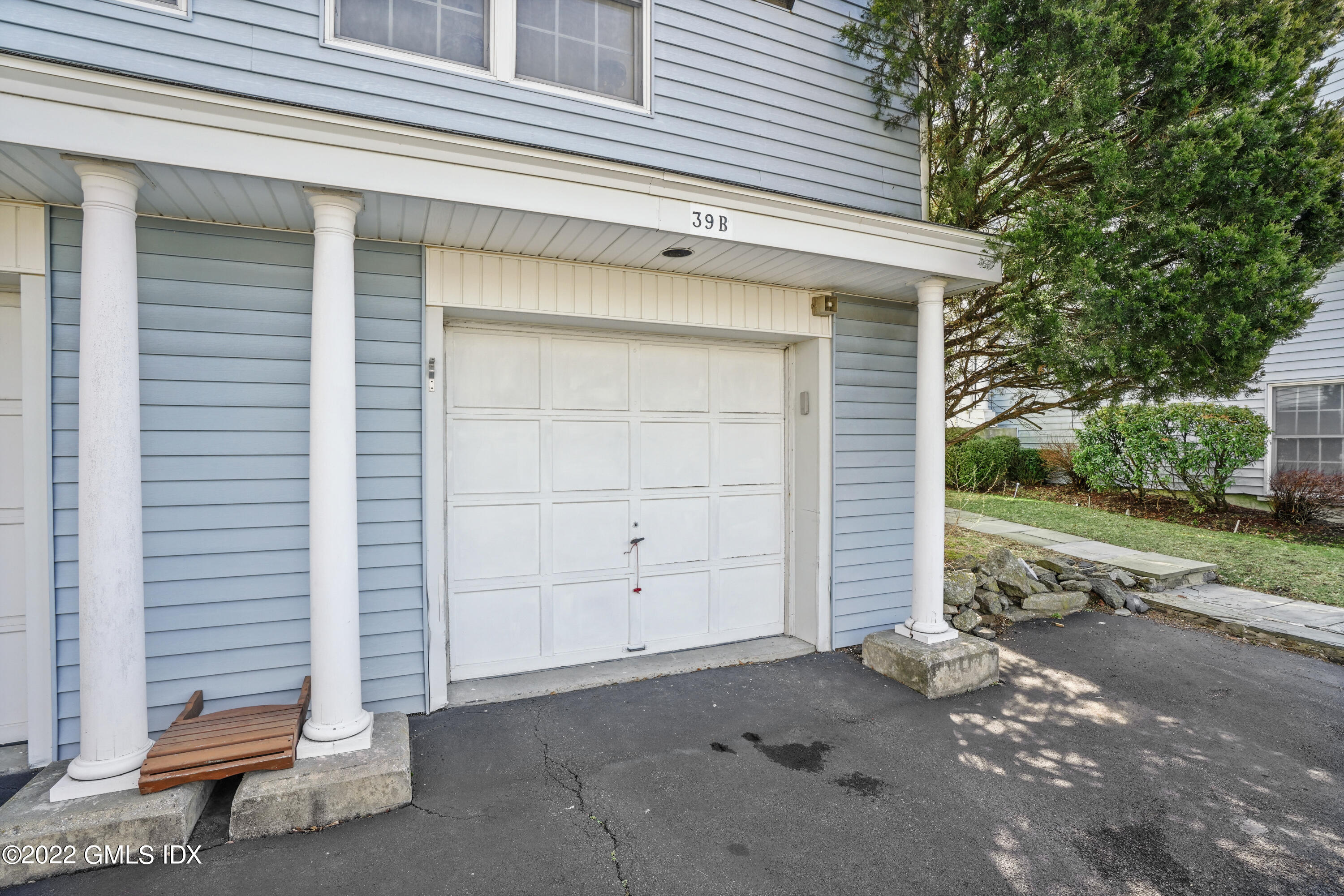 39 Alexander Street, Unit B Greenwich, CT 06830 - Photo 14 of 17 a view of a house with a garage