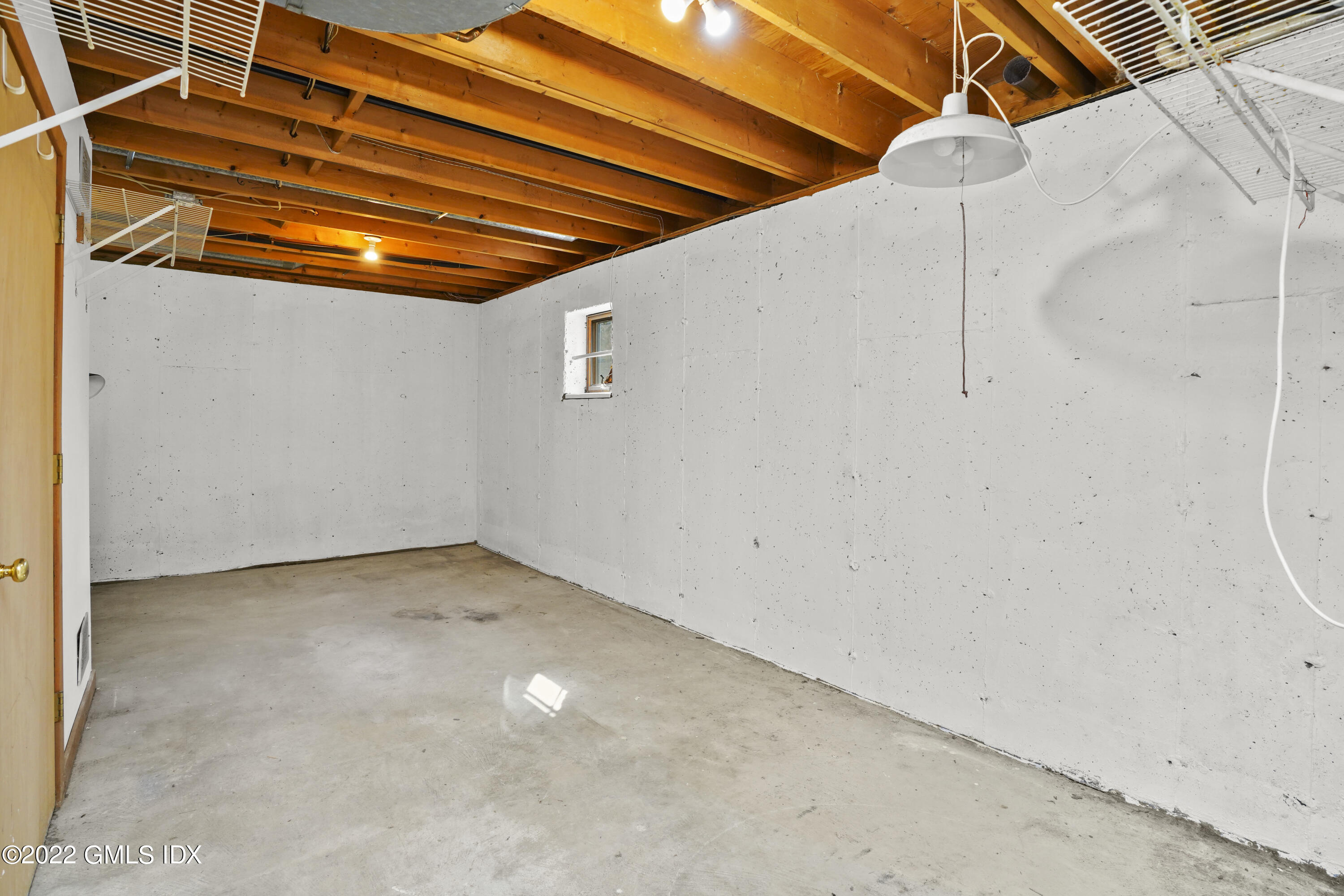 39 Alexander Street, Unit B Greenwich, CT 06830 - Photo 10 of 17 a view of a room with racks on the wall