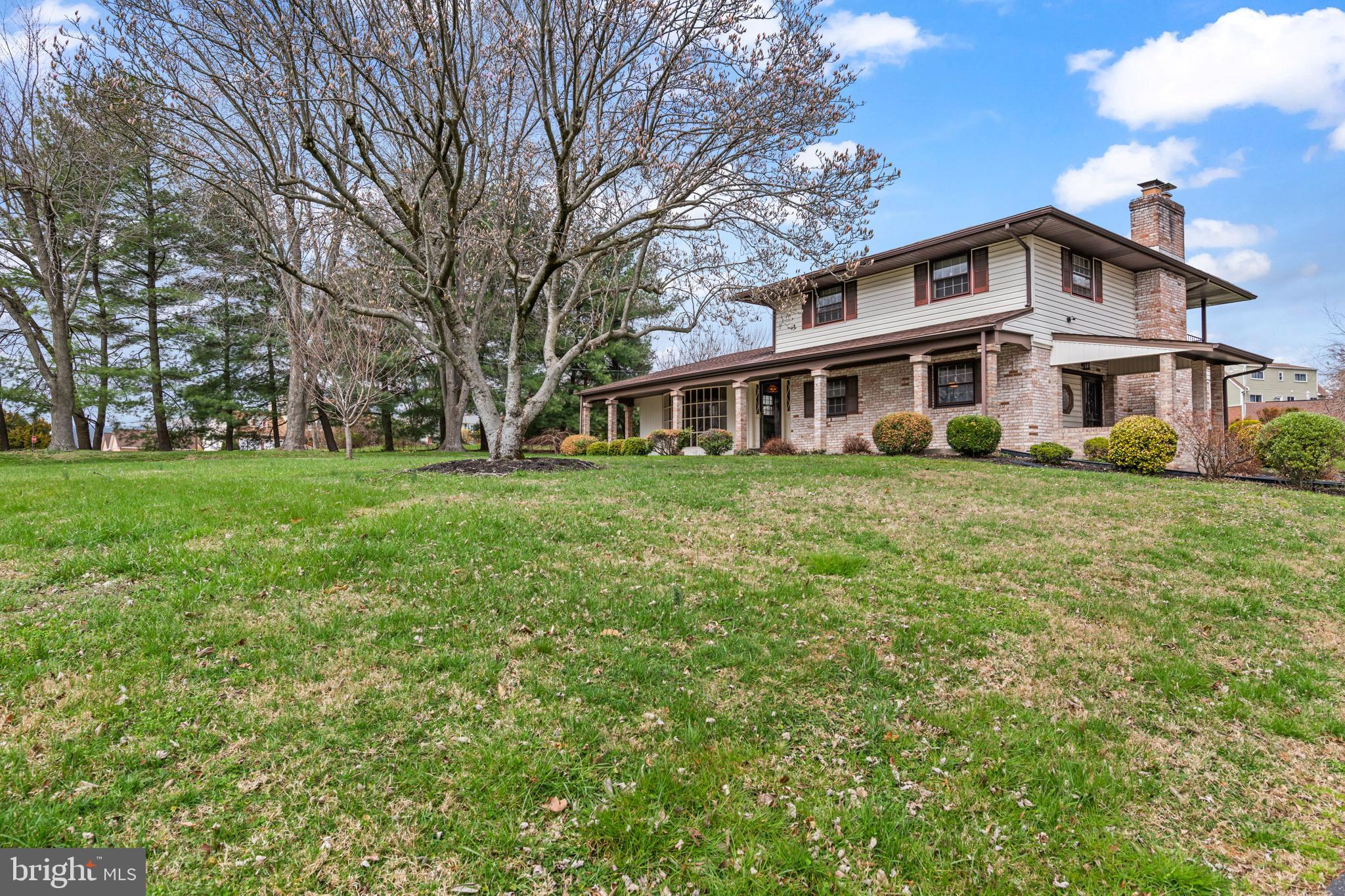 5030 Silver Spring Road Perry Hall, MD 21128 - Photo 11 of 97 a view of a house with a big yard and large trees
