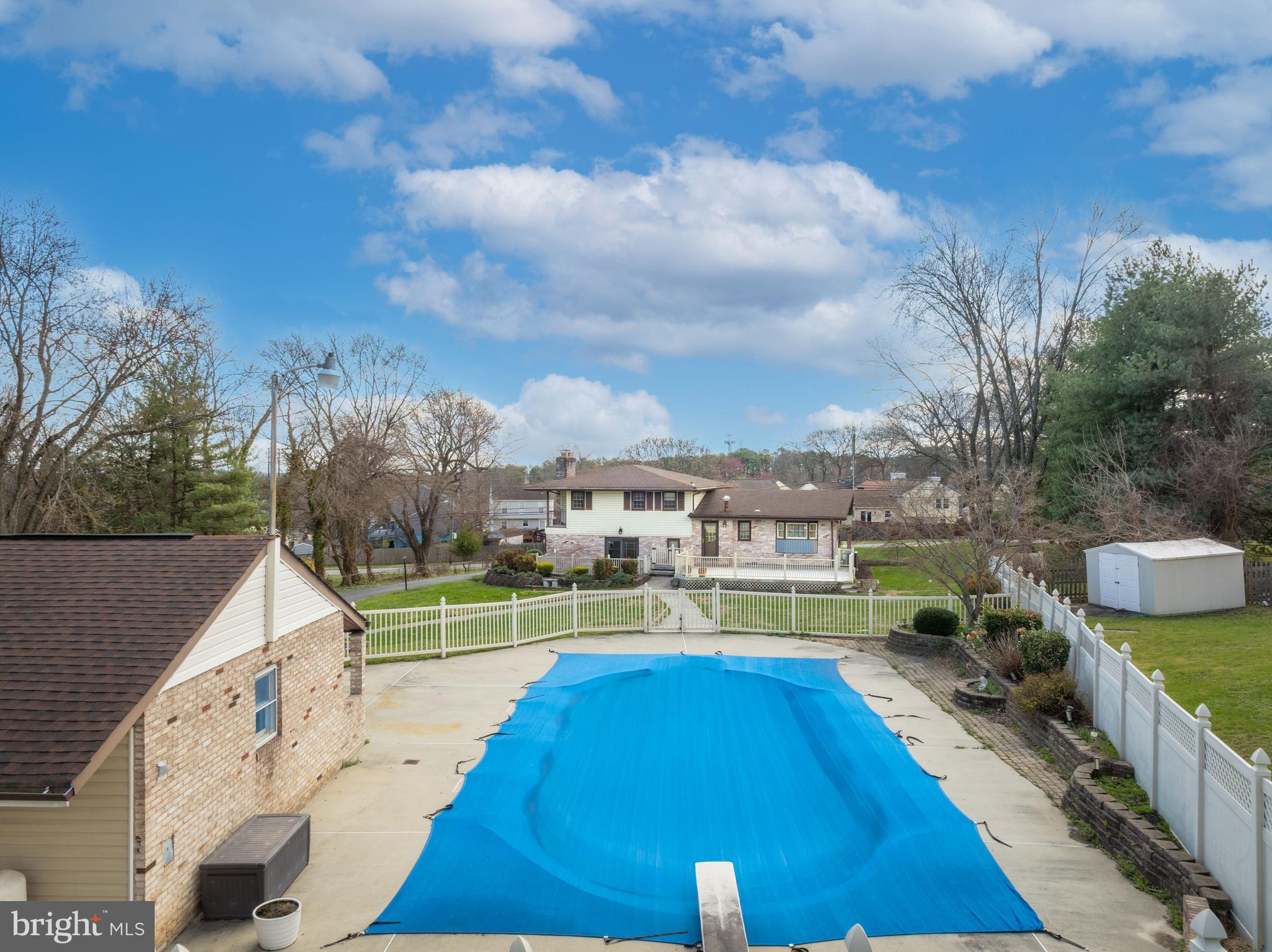 5030 Silver Spring Road Perry Hall, MD 21128 - Photo 15 of 97 a view of a swimming pool with a patio