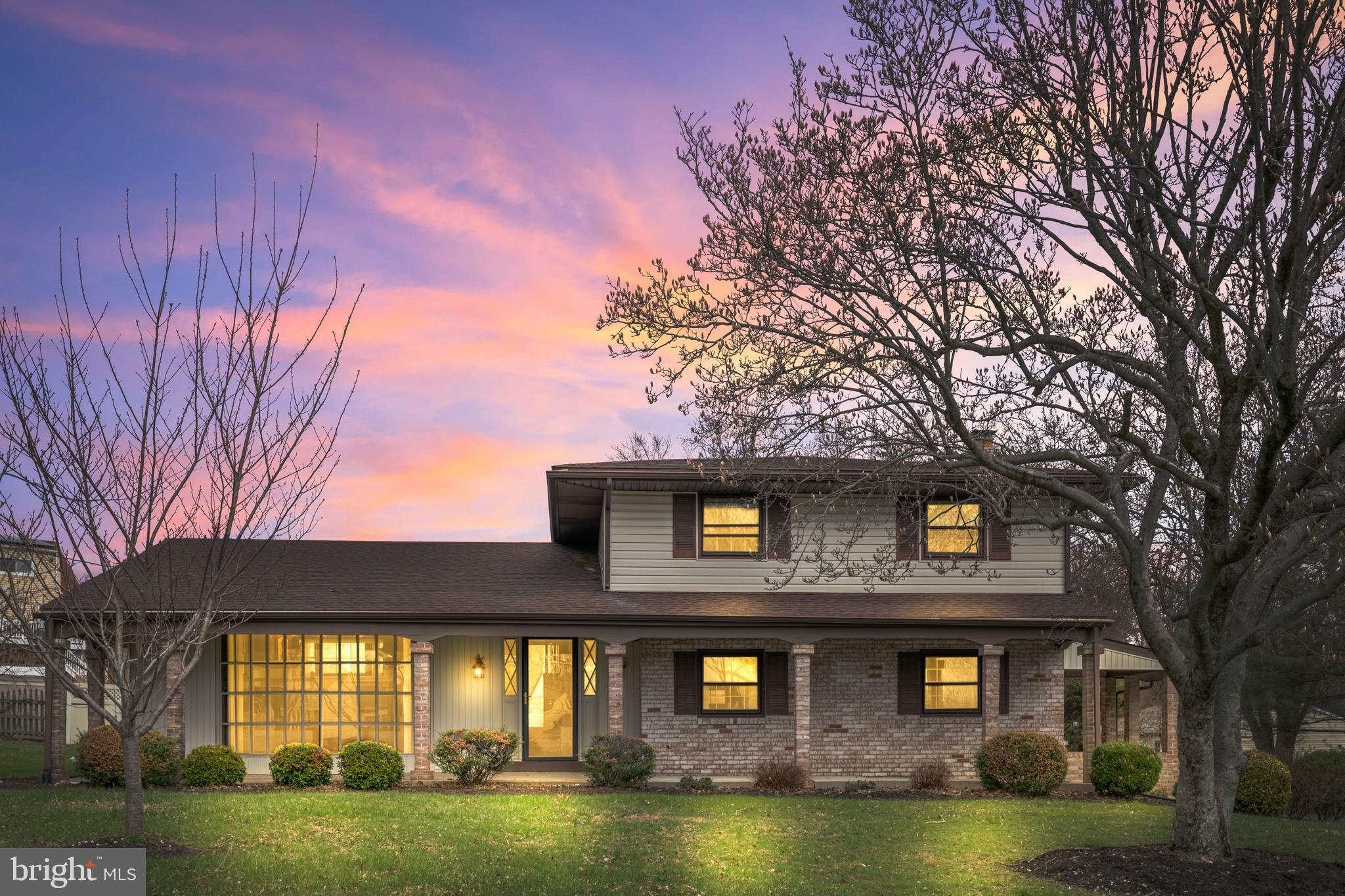 5030 Silver Spring Road Perry Hall, MD 21128 - Photo 2 of 97 a front view of a house with a garden