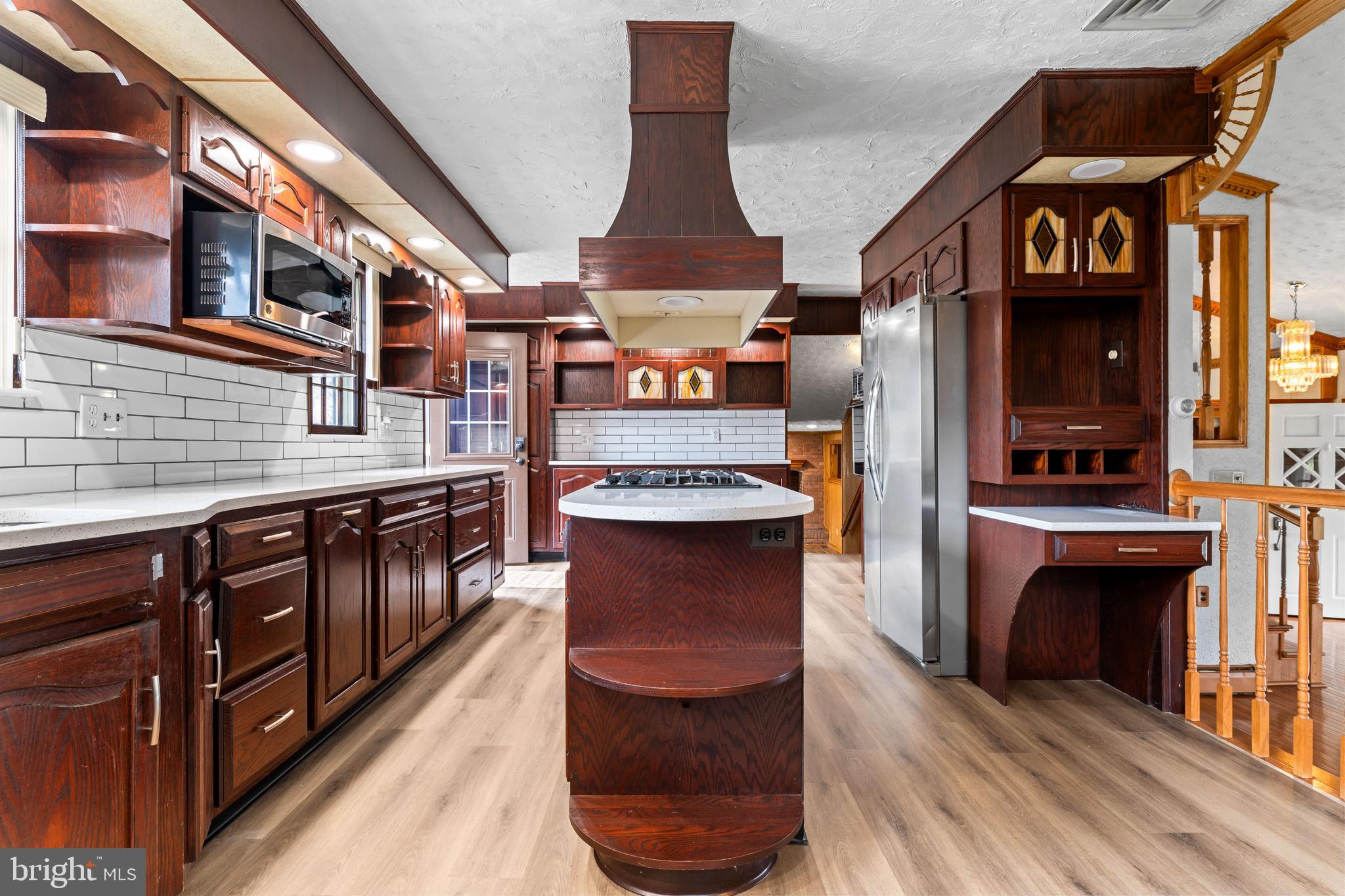 5030 Silver Spring Road Perry Hall, MD 21128 - Photo 34 of 97 a view of a kitchen with stainless steel appliances granite countertop a stove a sink and a refrigerator