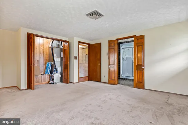 a view of a livingroom with a ceiling fan and window