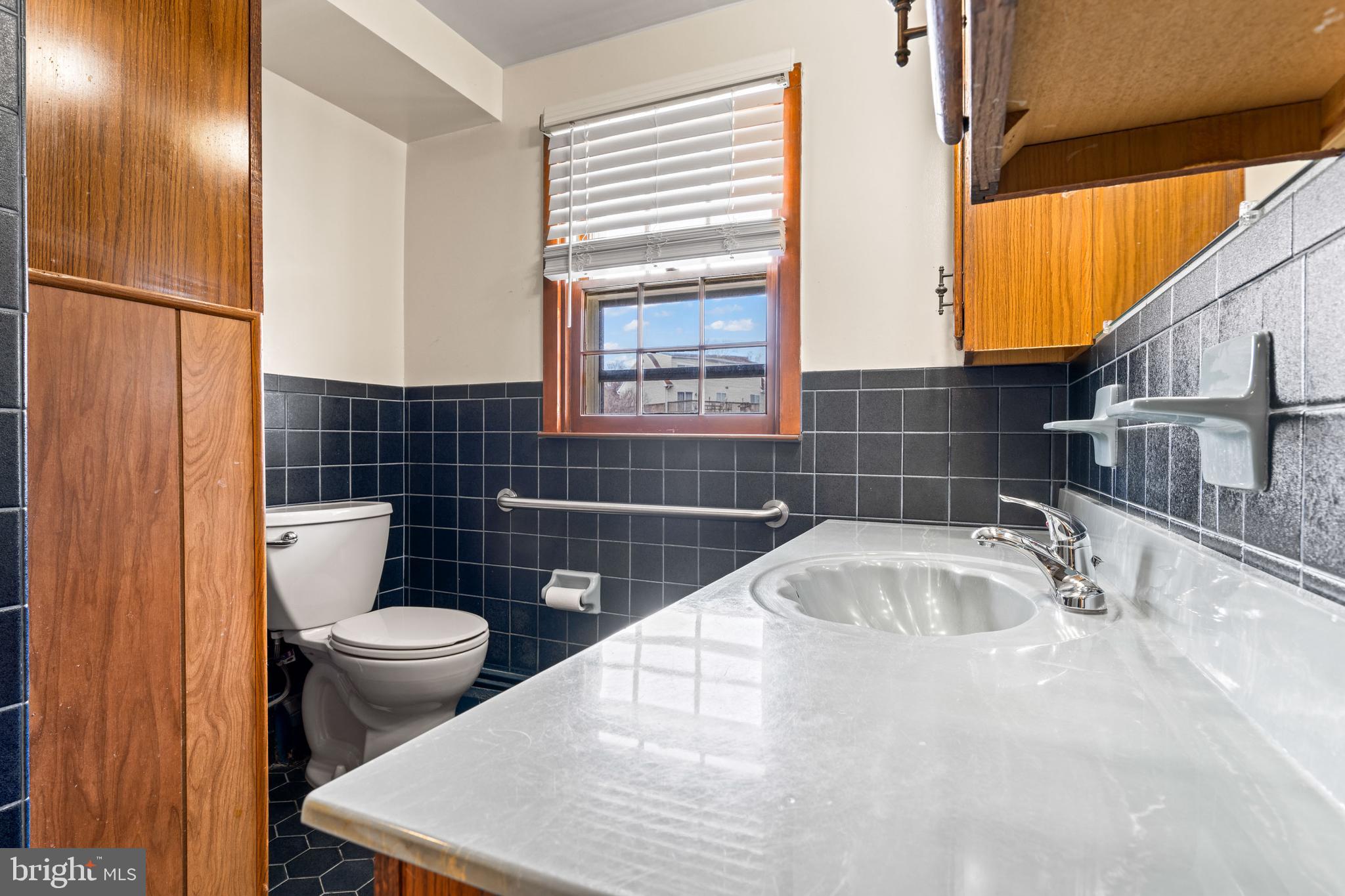 5030 Silver Spring Road Perry Hall, MD 21128 - Photo 48 of 97 a bathroom with a sink a toilet and shower