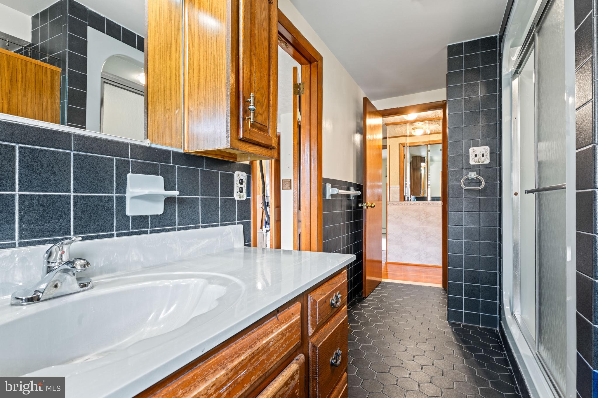 5030 Silver Spring Road Perry Hall, MD 21128 - Photo 49 of 97 a bathroom with a tub and a sink
