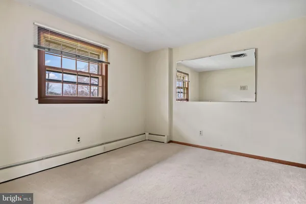 a view of an entryway with wooden floors