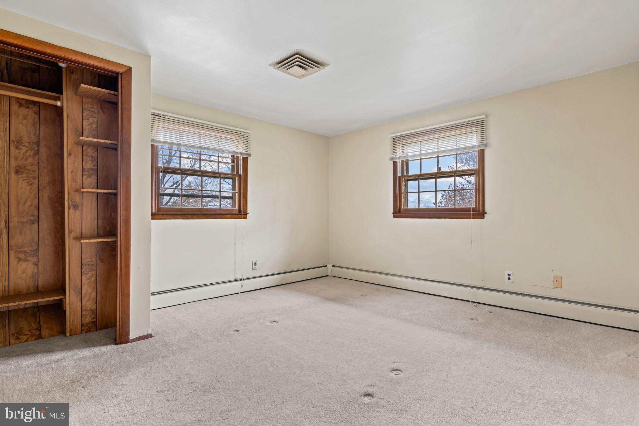 5030 Silver Spring Road Perry Hall, MD 21128 - Photo 53 of 97 an empty room with windows and closet