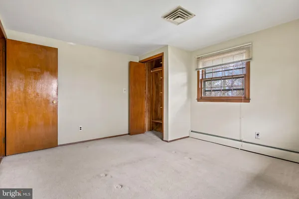 a front view of a residential apartment building with a yard