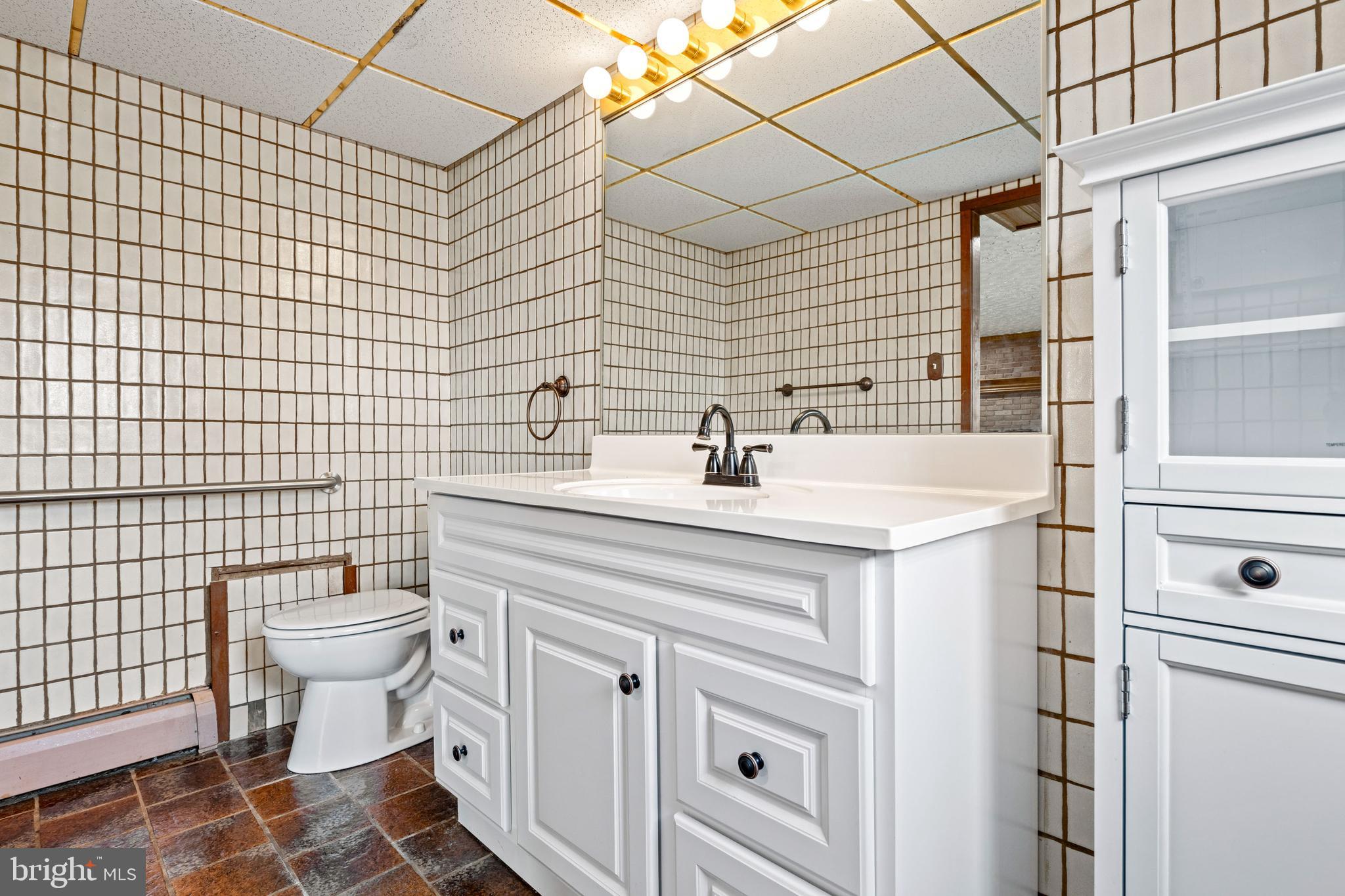 5030 Silver Spring Road Perry Hall, MD 21128 - Photo 60 of 97 a bathroom with a sink toilet and shower