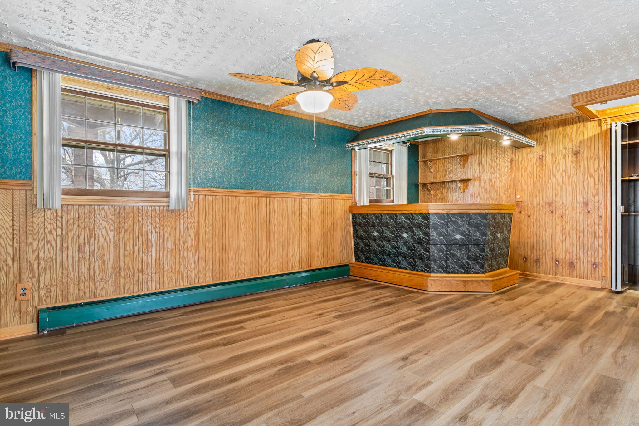 5030 Silver Spring Road Perry Hall, MD 21128 - Photo 62 of 97 a view of an empty room with wooden floor and a window