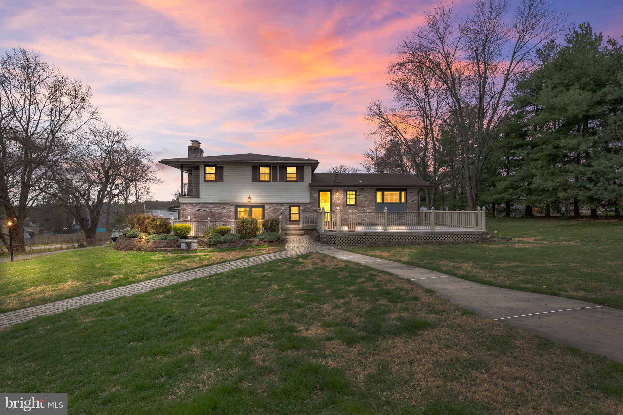 5030 Silver Spring Road Perry Hall, MD 21128 - Photo 9 of 97 a view of a big house with a big yard and large trees