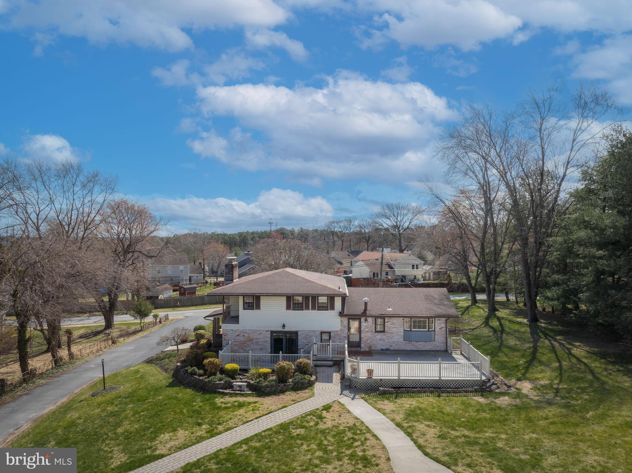 5030 Silver Spring Road Perry Hall, MD 21128 - Photo 97 of 97 a view of a big house with a big yard and large trees