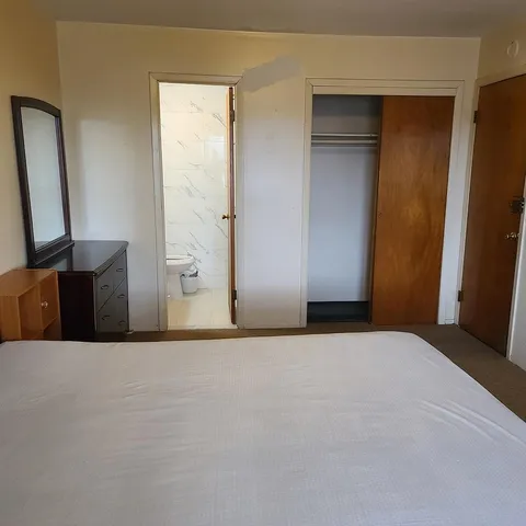 a view of an empty room with wooden door