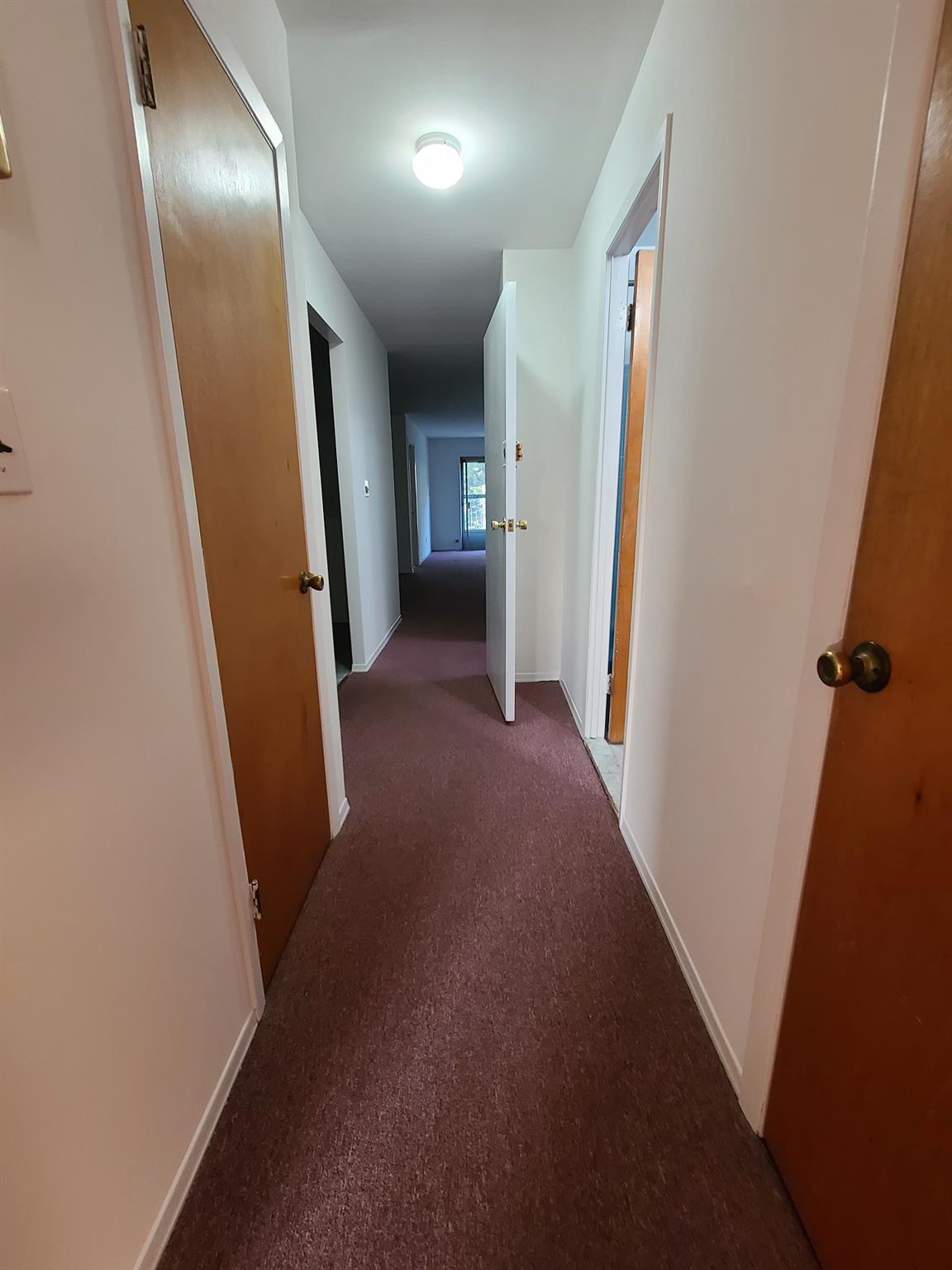 85-10 165th Street Queens, NY 11432 - Photo 18 of 24 a view of hallway with stairs